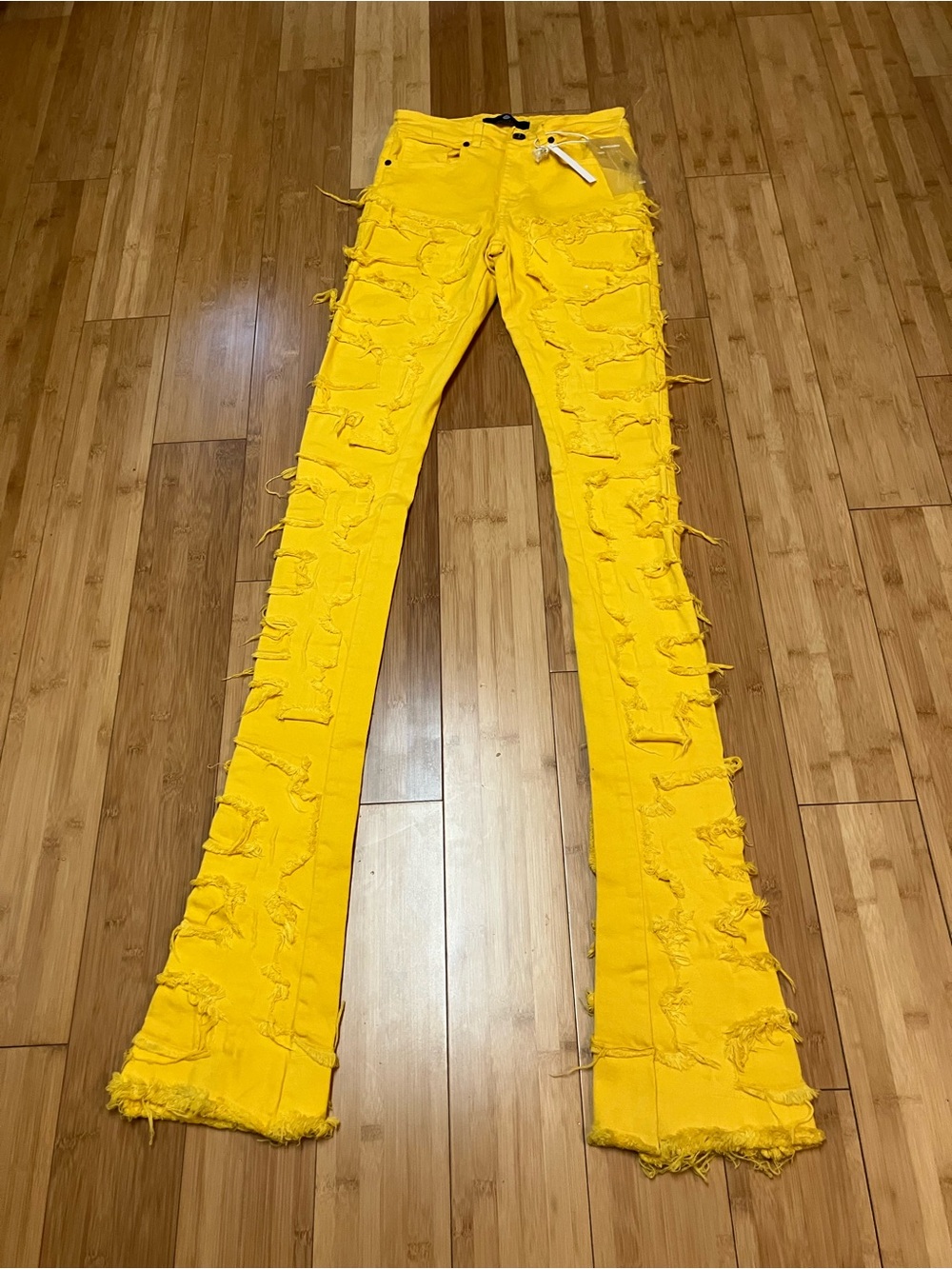 FOCUS yellow distressed stacker jeans NWT